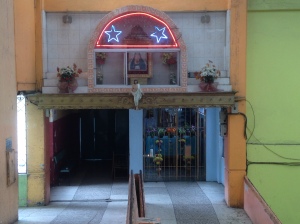 Lit up shrine at the entrance of Mercado de Santa Clara