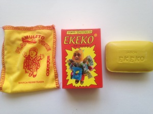 Ekeko Soap, which draws on the power of the Bolivian god of plenty, Ekeko. The bar comes in a cloth sack with an image of Ekeko, and is stamped with 'Jabon Ekeko'. The instructions state that you must quietly say a prayed for what you desire while making the sign of the cross with the soap before washing with it.